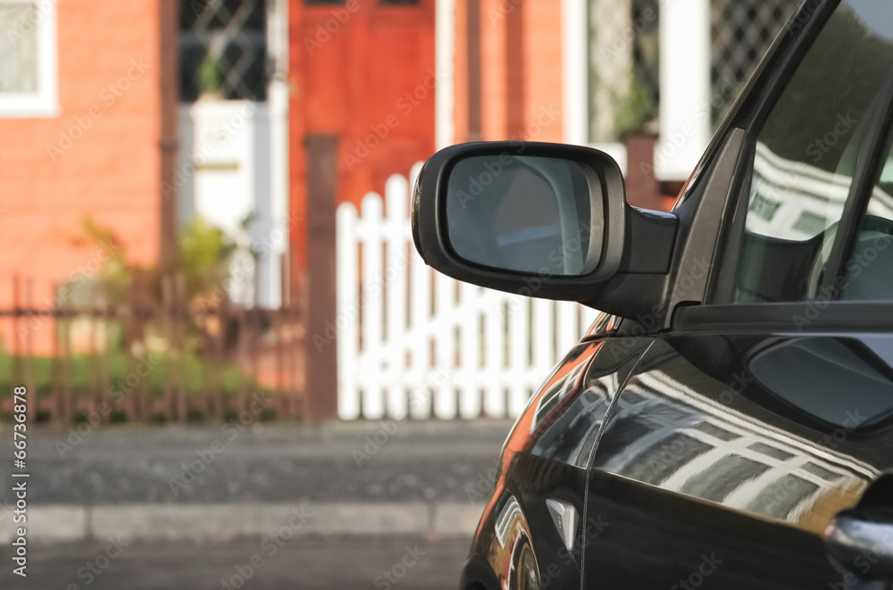 mysterious car parked outside a house