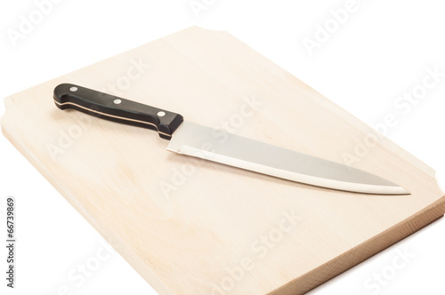 Cook knife on a wooden board..