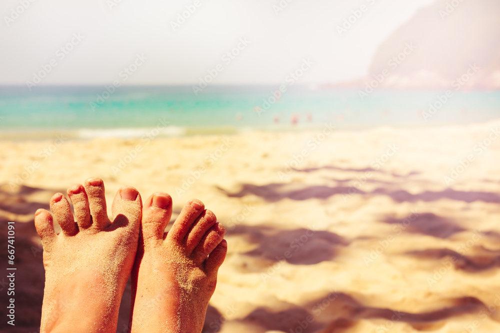 Fototapeta premium Tropical beach. Vintage effect. Legs.