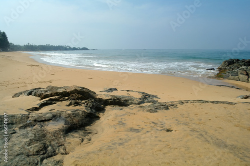 Stones on the idyllic beach in Sri Lanka. © ekulik2011