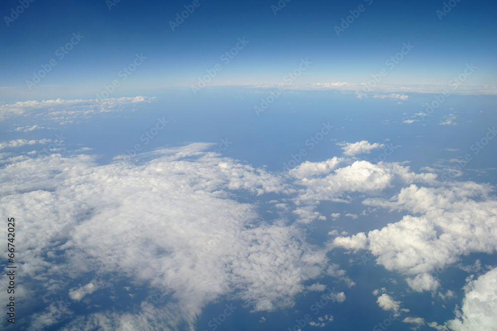 Fototapeta premium clouds and blue sky seen from plane