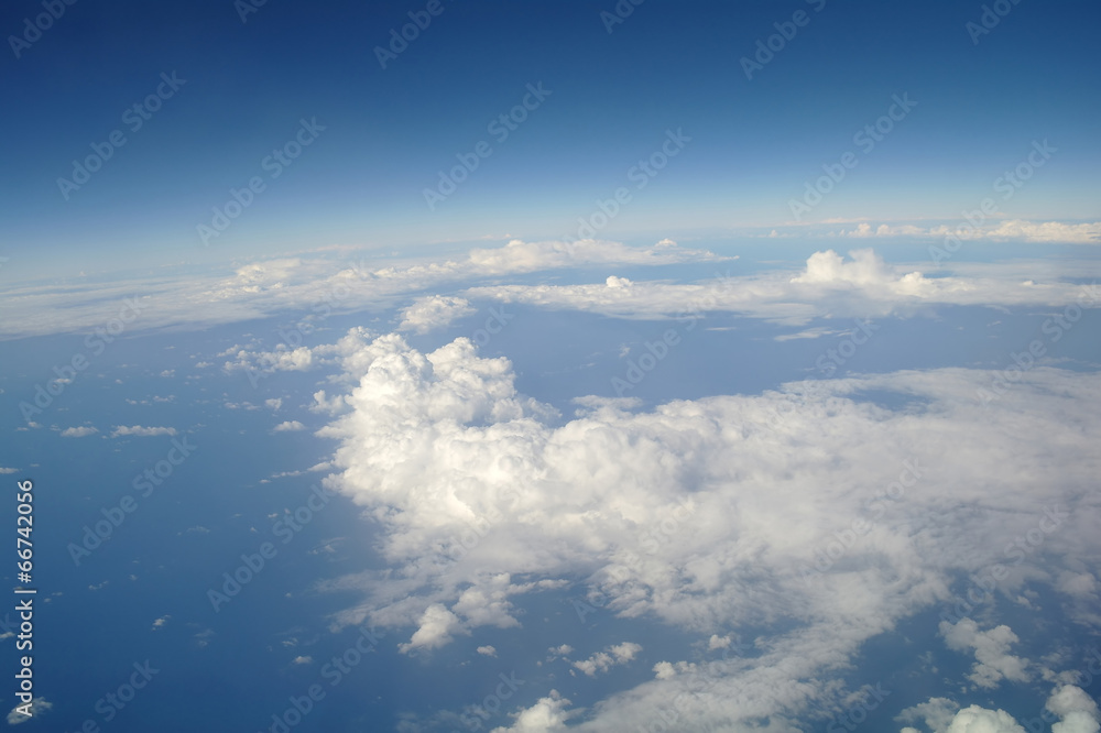 Fototapeta premium clouds and blue sky seen from plane