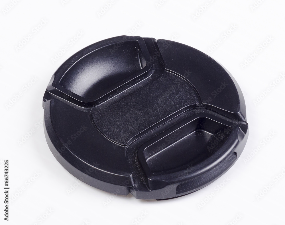 A black isolated camera lens cap A black isolated camera lens cap