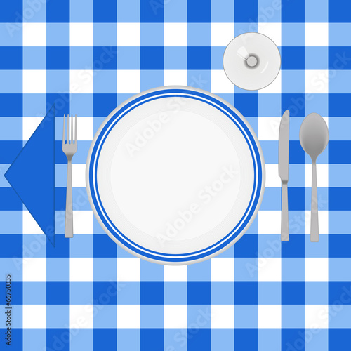 Blue cloth table with cutlery