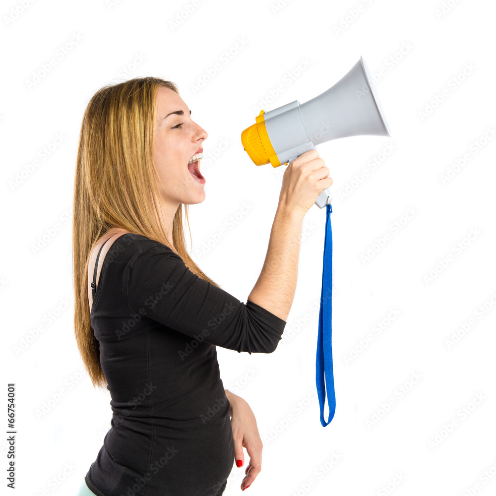 Pretty girl shouting with a megaphone over white background Pretty girl shouting with a megaphone over white background