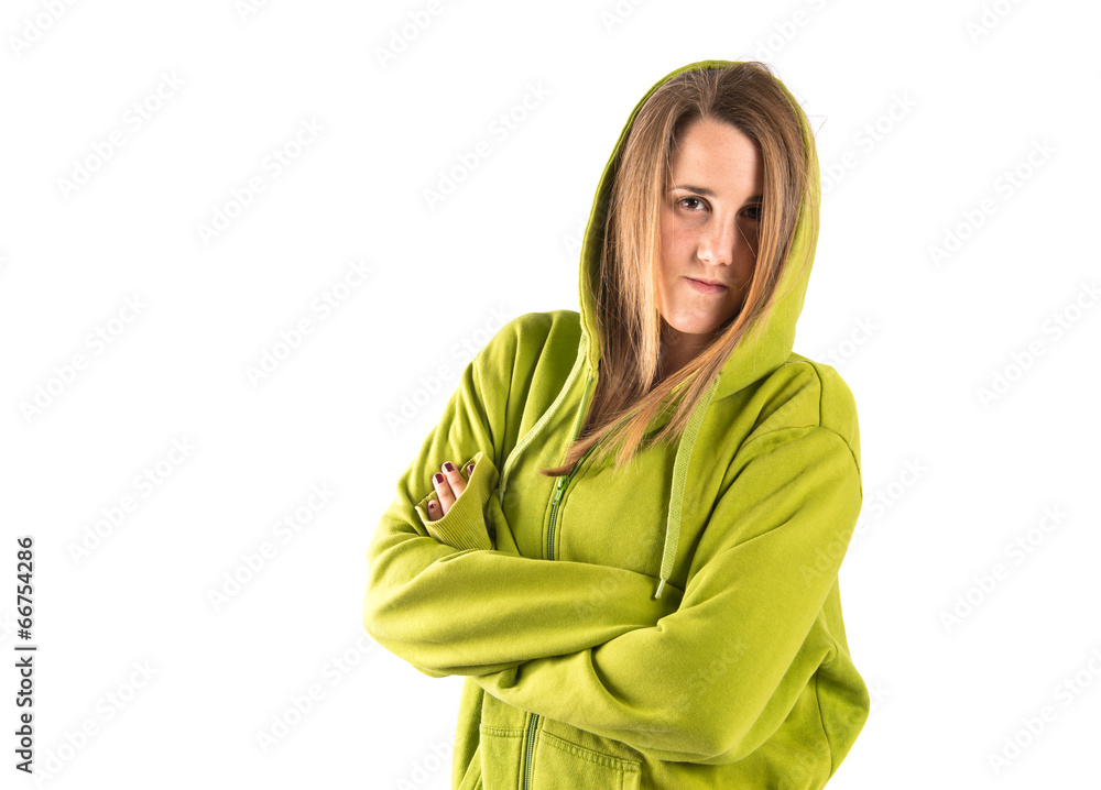 Young girl with hers arms crossed over white background