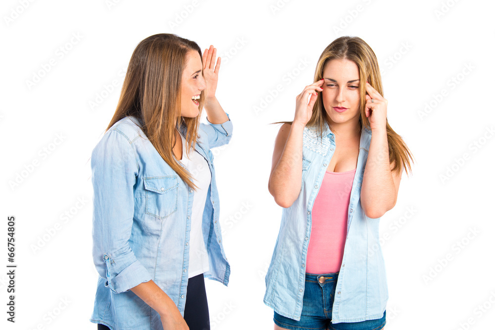 Girl shouting at her friend over white background Girl shouting at her friend over white background
