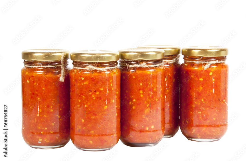 Bottles of Bright Red Chilli Preserve known as Mazavaroo Bottles of Bright Red Chilli Preserve known as Mazavaroo