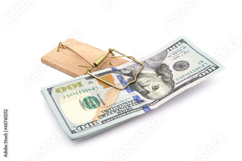 Money in a mousetrap on a white background