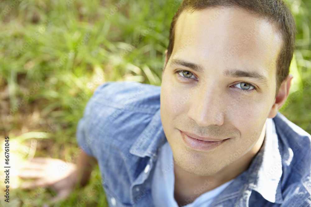 Man sitting on grass Man sitting on grass