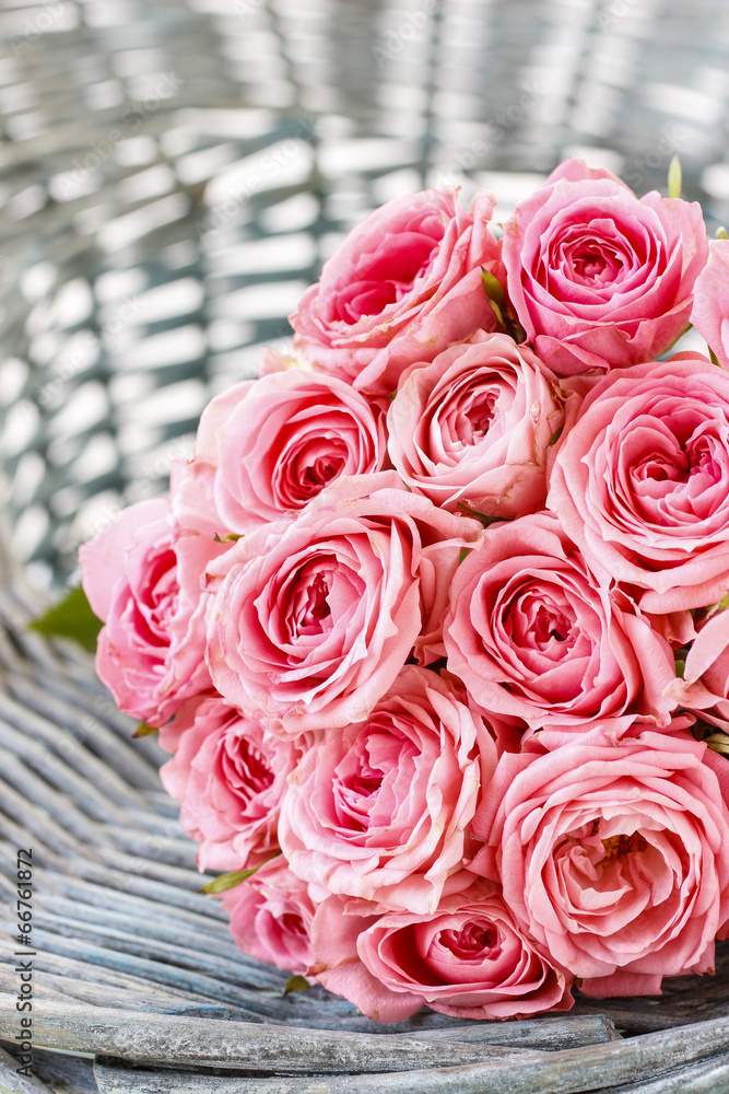 Pink roses in wicker basket Pink roses in wicker basket