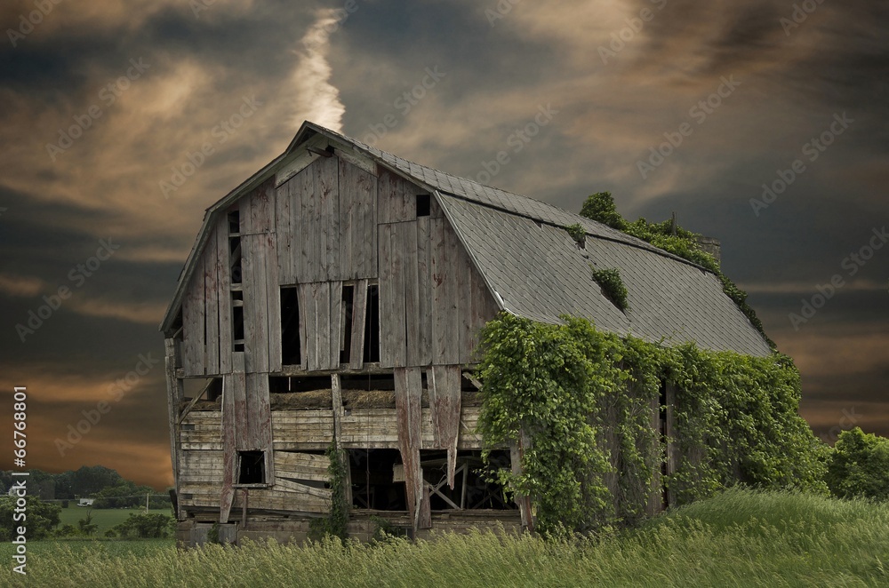 Obraz premium dilapidated barn with sunset sky