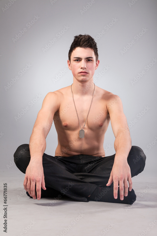 Healthy muscular young man on grey background Healthy muscular young man on grey background