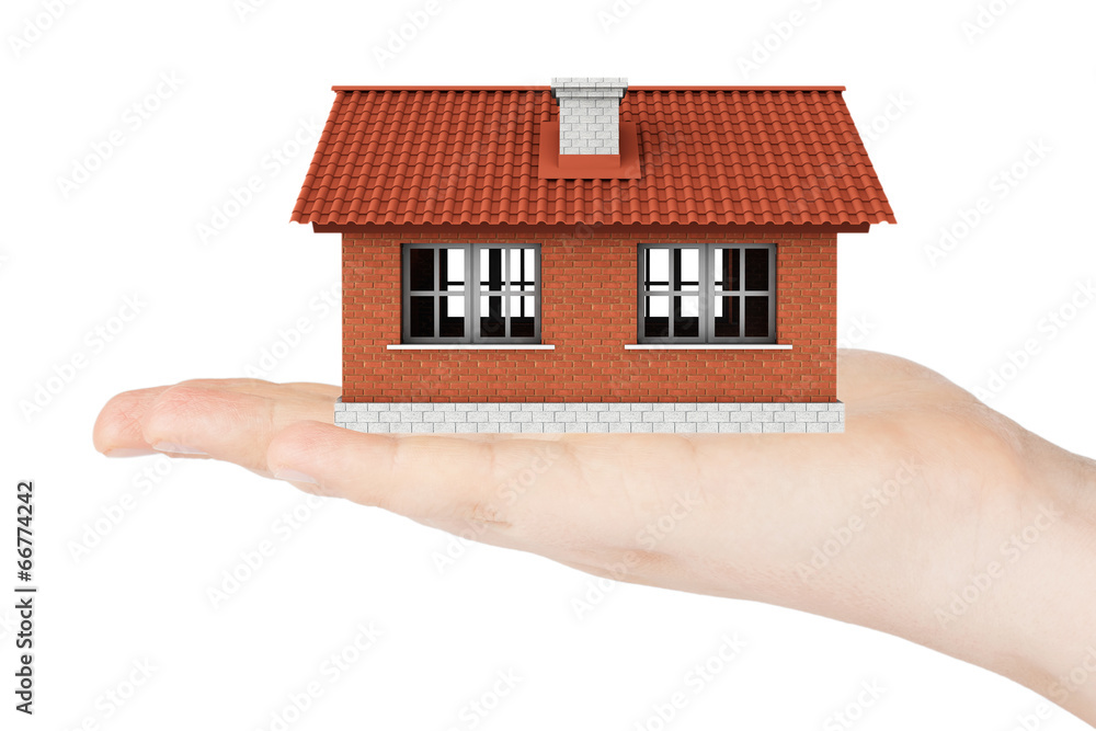 Real Estate Concept. House model in the hand Real Estate Concept. House model in the hand