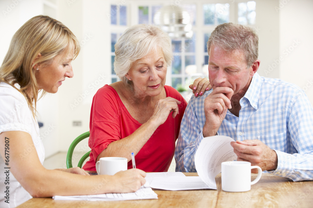 Retired couple with financial advisor Retired couple with financial advisor