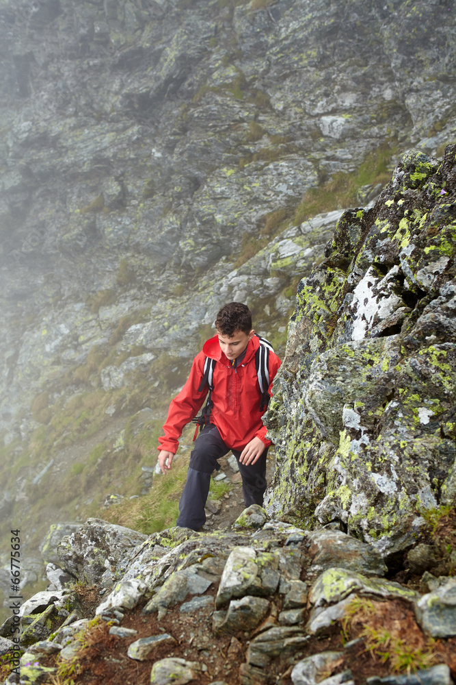 Teenage hiker on mountain