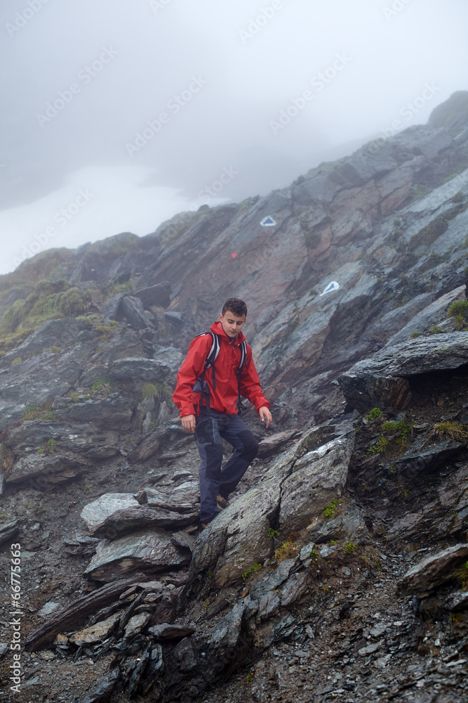 Fototapeta premium Teenage hiker on mountain