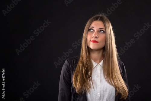 Thinking businesswoman portrait