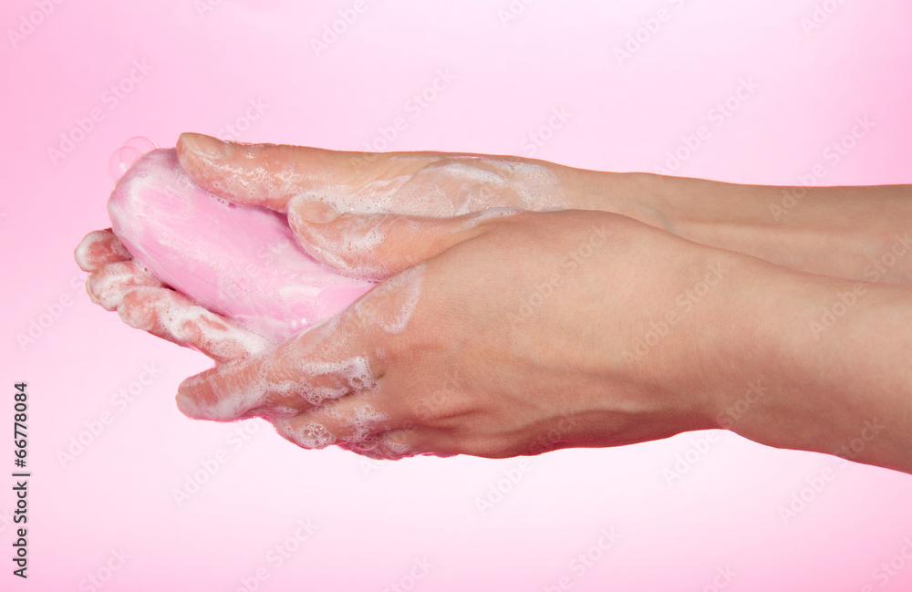 The woman washes hands about the soap The woman washes hands about the soap
