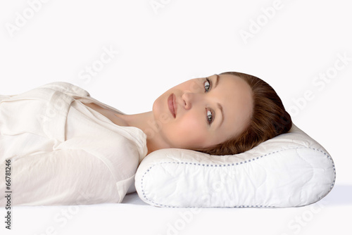 Young woman sleeping on an orthopedic pillow