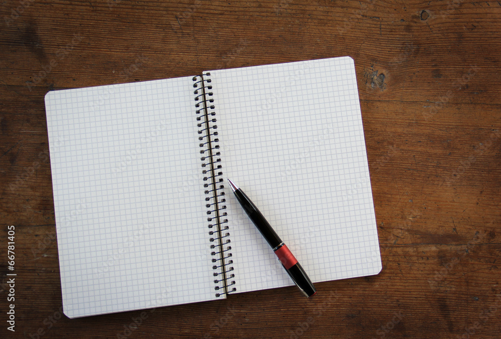 Notebook on wooden table Notebook on wooden table