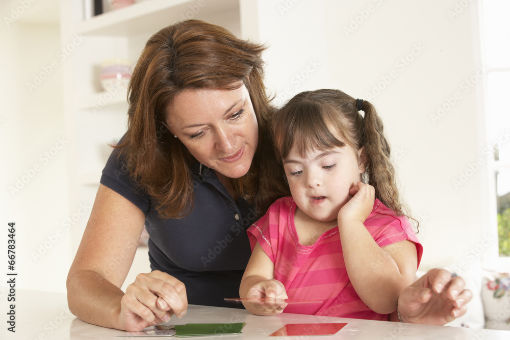 Downs Syndrome girl having speech therapy Downs Syndrome girl having speech therapy