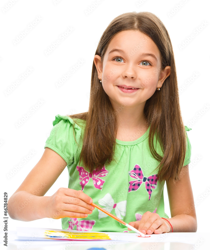 Little girl is painting with gouache Little girl is painting with gouache