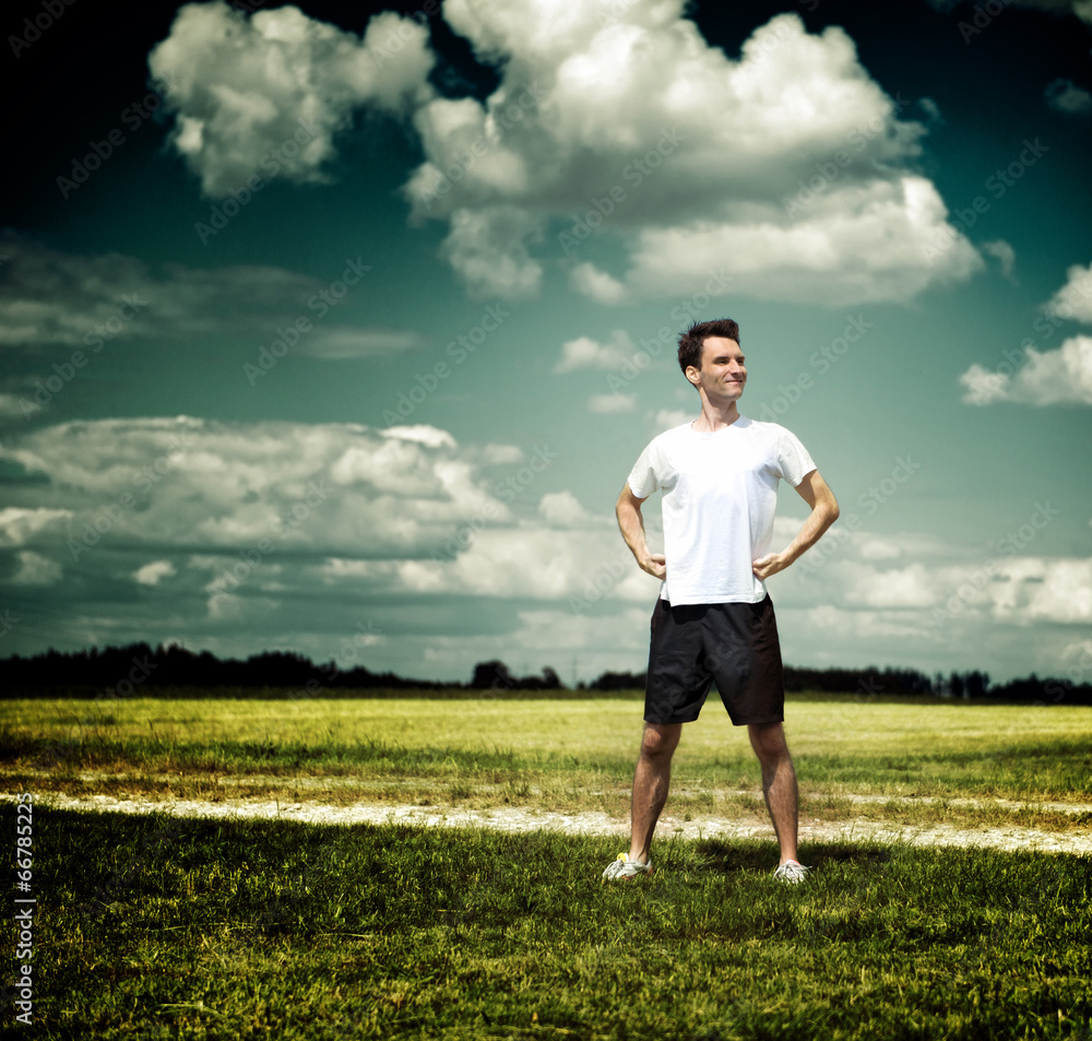 Fit athlete pausing to admire the countryside Fit athlete pausing to admire the countryside
