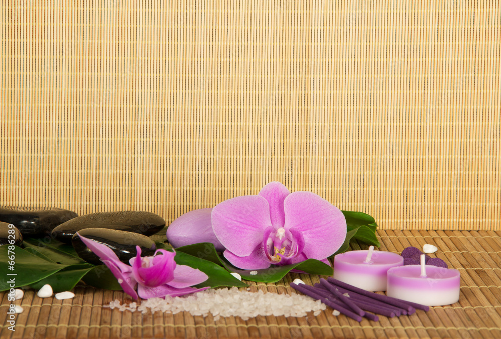 Flowers of an orchid and set for Spa