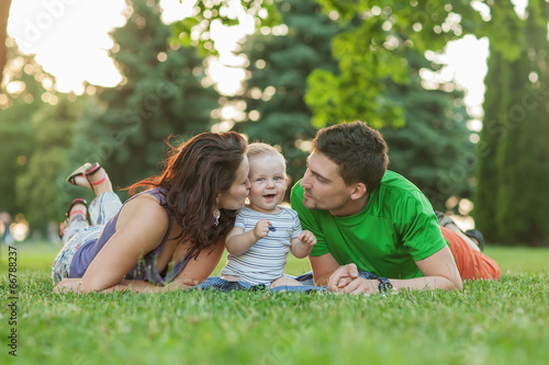 Young Attractive Parents and Child Portrait Outdoors