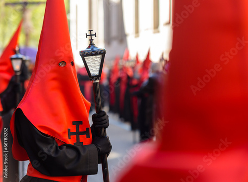 Red nazareno with a lamp in the Good Thursday during Holy Week photo