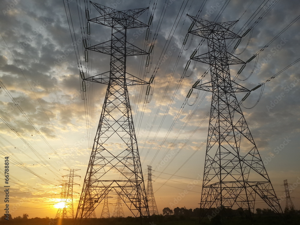 Pylon high voltage power lime in sunset