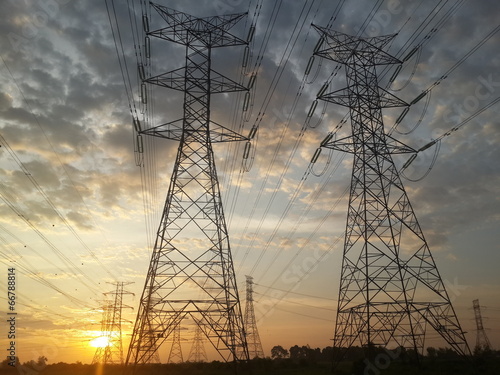 Pylon high voltage power lime in sunset