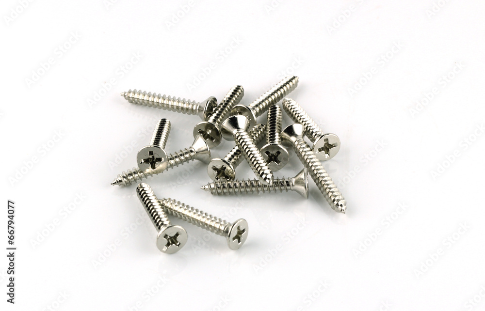 Screws located on a white background Screws located on a white background