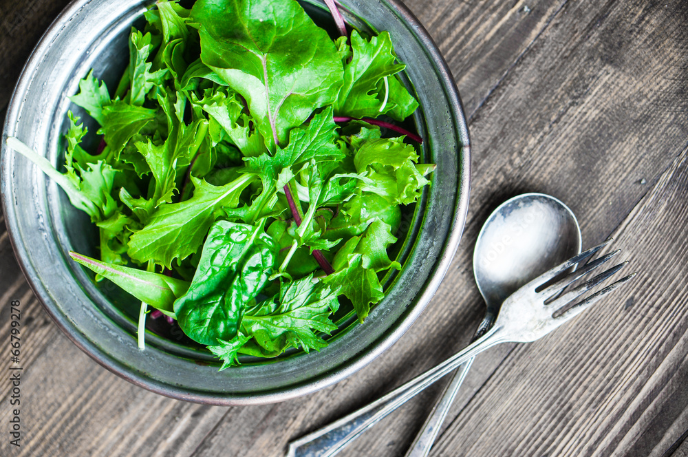 Green salad on rustic background Green salad on rustic background
