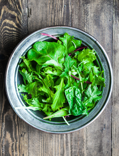 Green salad on rustic background