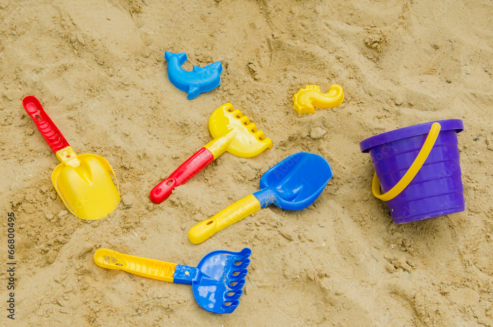Toys in the sand - shovel, stencils, rakes Toys in the sand - shovel, stencils, rakes