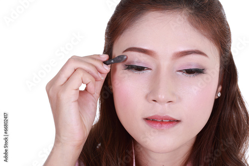 woman applying eyeshadow powder