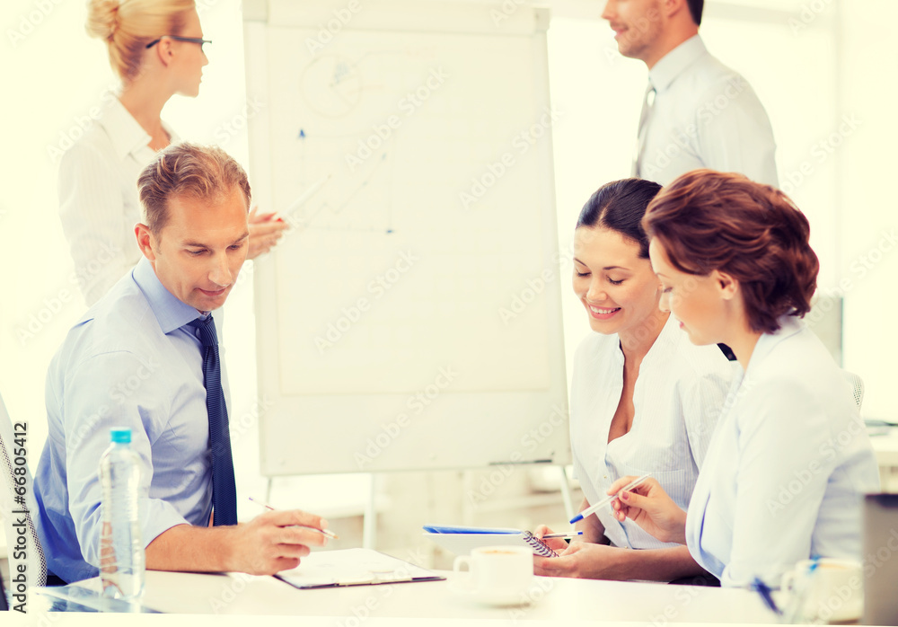 business team discussing something in office business team discussing something in office
