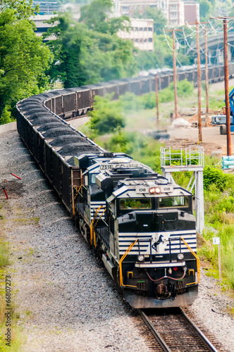 slow moving Coal wagons on railway tracks