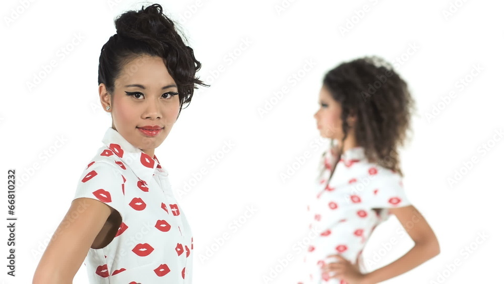 Two multi cultural models posing on white background Two multi cultural models posing on white background