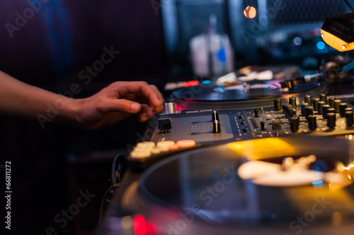Dj mixing in night club