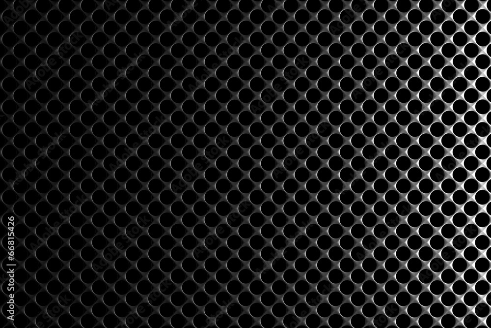Steel grid with round holes under right straight light Steel grid with round holes under right straight light