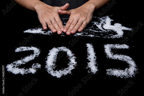 Photos Female hands wiping Year 2014 leaving Year 2015