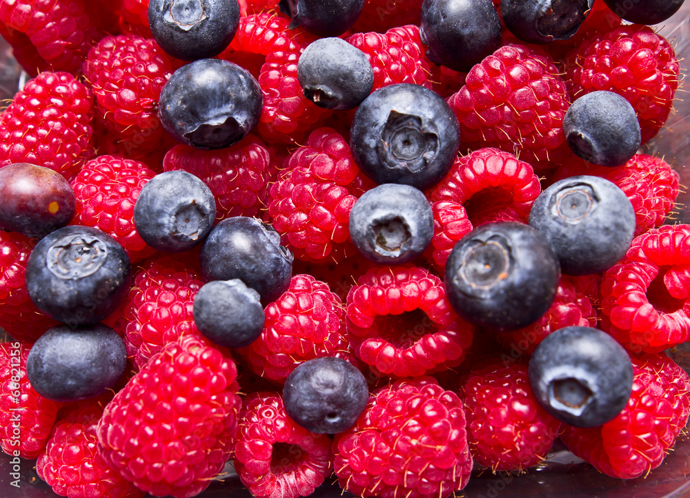 Raspberry and blueberry background Raspberry and blueberry background