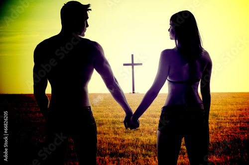 Romantic young couple holding hands photo