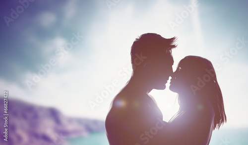 Konstfotografi Loving couple backlit by a bright sun