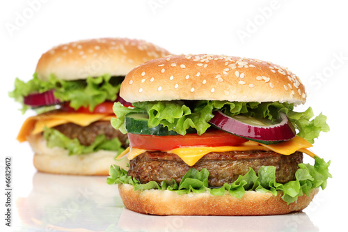 Two delicious hamburgers isolated on white background