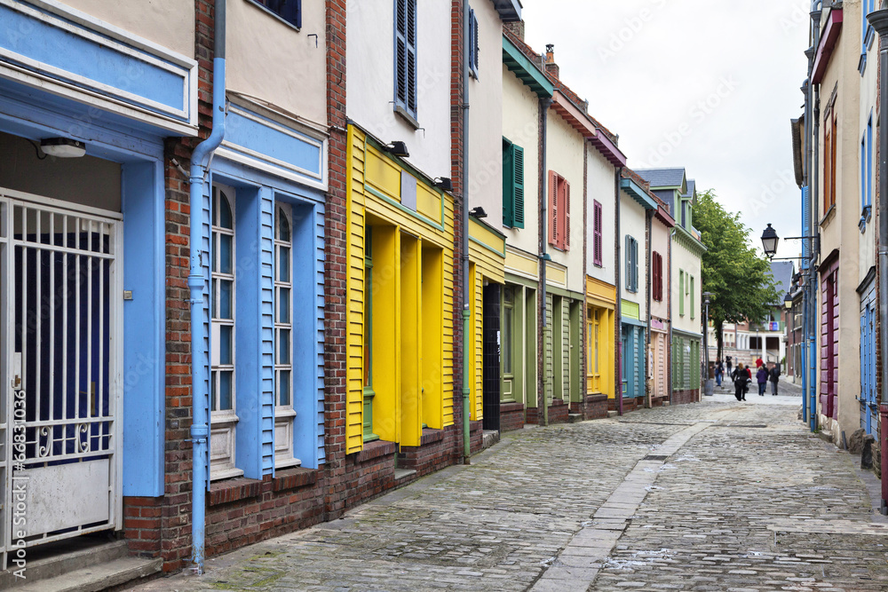 Narrow street with a small colorful houses in Amiens, France