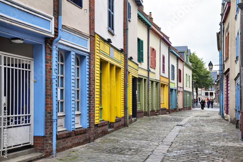 Narrow street with a small colorful houses in Amiens  France